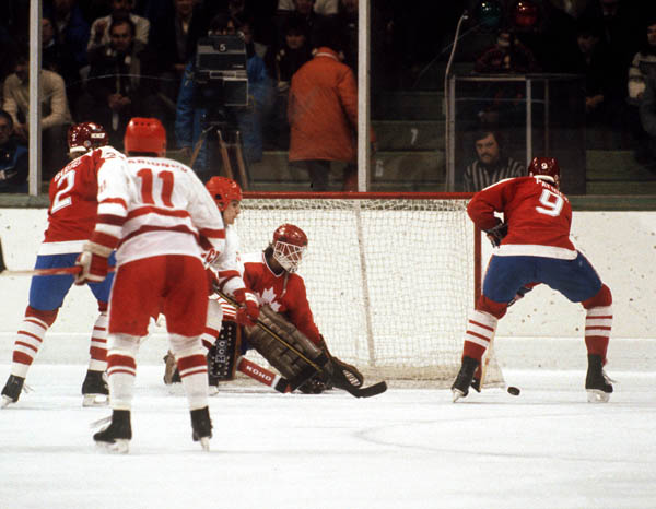 Canada's Robin Bartel (left) and James Patrick (right) come to the help of goalie Mario Goselin during hockey action against Czechoslovakiaat the 1984 Winter Olympics in Sarajevo. (CP PHOTO/ COA/O. Bierwagon )