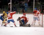 Canada's Doug Lidster (left) and Mario Gosselin (goalie) compete in hockey action against Sweden at the 1984 Winter Olympics in Sarajevo. (CP PHOTO/ COA/O. Bierwagon )