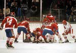 From left, Canada's Darren Lowe (14), James Patrick, Mario Gosselin (goalie) and Jean-Jacques Daigneault scramble to defend the crease during hockey action against the USSR at the 1984 Winter Olympics in Sarajevo. (CP PHOTO/ COA/O. Bierwagon )