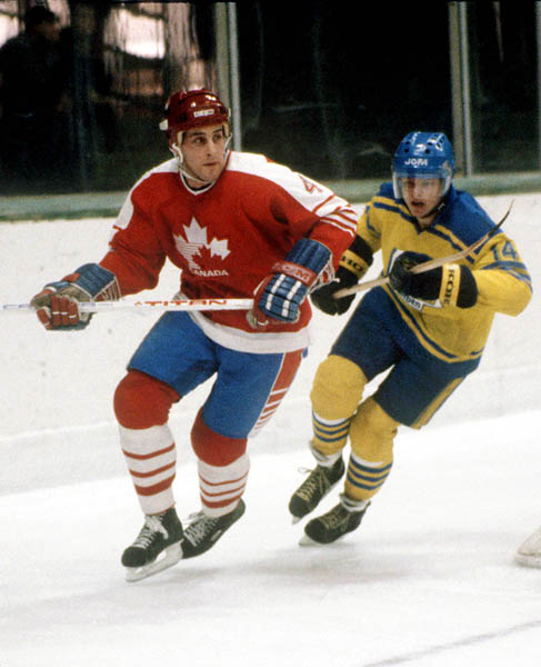 Canada's Doug Lidster is pursued by a player from Sweden during hockey action at the 1984 Winter Olympics in Sarajevo. (CP PHOTO/ COA/O. Bierwagon )