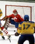 Canada's Doug Lidster (4) and Mario Gosselin (goalie) compete in hockey action against the United States at the 1984 Winter Olympics in Sarajevo. (CP PHOTO/ COA/O. Bierwagon )