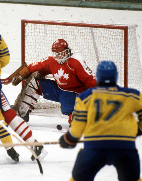 Canada's Mario Gosselin (goalie) makes a save during hockey action against Sweden at the 1984 Winter Olympics in Sarajevo. (CP PHOTO/ COA/O. Bierwagon )