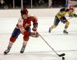 Russ Courtnall (right) avoids a check from Zenetoula Bilyatletdinov of the USSR during hockey action at the 1984 Winter Olympics in Sarajevo. (CP PHOTO/ COA/O. Bierwagon )