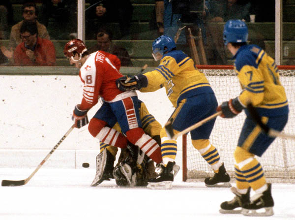 Canada's Dave Tippett (#8) competes in hockey action against Sweden at the 1984 Winter Olympics in Sarajevo. (CP PHOTO/ COA/O. Bierwagon )