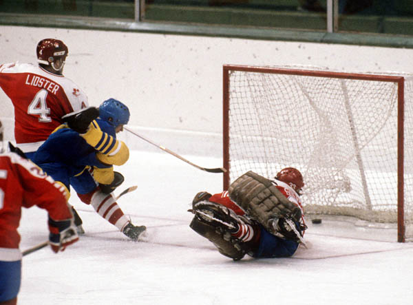 Canada's Doug Lidster (left) and Mario Gosselin (goalie) look helplessly as Team Sweden score during hockey action at the 1984 Winter Olympics in Sarajevo. (CP PHOTO/ COA/O. Bierwagon )
