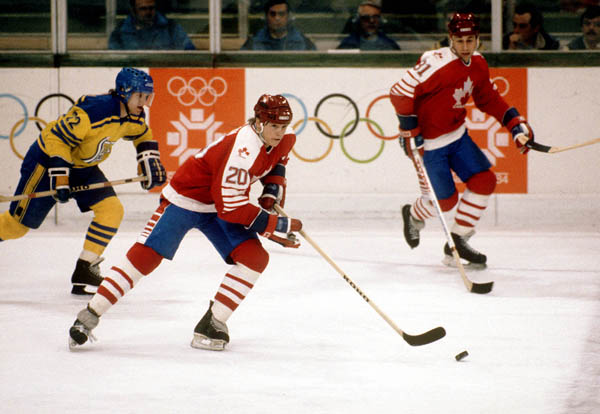 Canada's Carey Wilson skates away as teammate Vaughn Karpan (right) looks on during hockey action against Sweden at the 1984 Winter Olympics in Sarajevo. (CP PHOTO/ COA/O. Bierwagon )