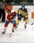 Canada's Doug Lidster (left) and Mario Gosselin (goalie) compete in hockey action against Sweden at the 1984 Winter Olympics in Sarajevo. (CP PHOTO/ COA/O. Bierwagon )