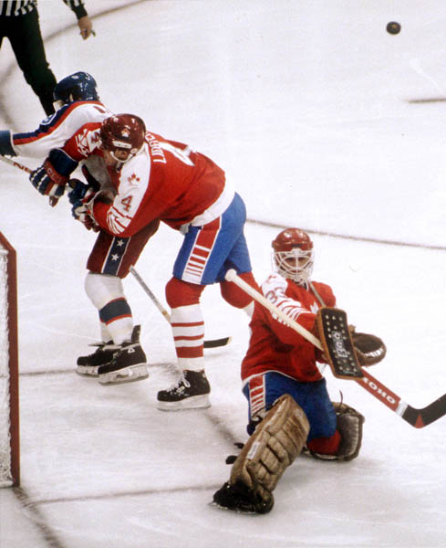 Canada's Doug Lidster (4) and Mario Gosselin (goalie) compete in hockey action against the United States at the 1984 Winter Olympics in Sarajevo. (CP PHOTO/ COA/O. Bierwagon )