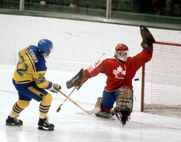 Canada's Mario Gosselin (goalie) faces a shot from Sweden's Karl Hakan Soedergren during hockey action at the 1984 Winter Olympics in Sarajevo. (CP PHOTO/ COA/O. Bierwagon )