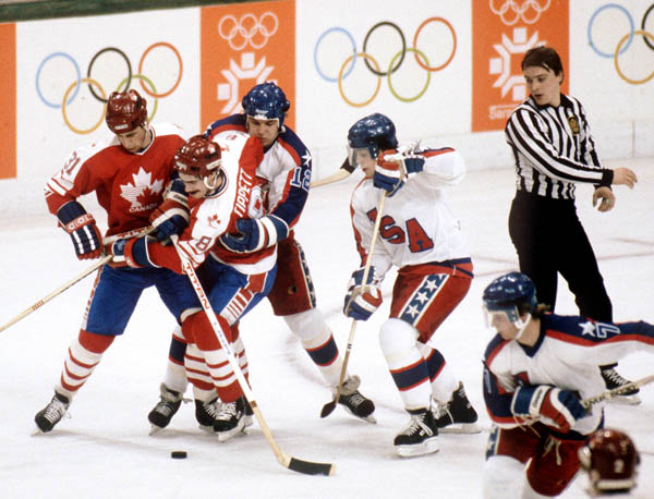 Canada's Vaughn Karpan (left) competes in hockey action against the United States at the 1984 Winter Olympics in Sarajevo. (CP PHOTO/ COA/O. Bierwagon )