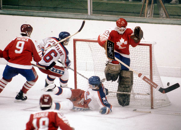 Canada's James Patrick (9) and Mario Gosselin (goalie) compete in hockey action against the United States at the 1984 Winter Olympics in Sarajevo. (CP PHOTO/ COA/O. Bierwagon )