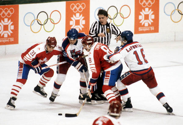 Canada's Vaughn Karpan (31) and Dave Tippett (8) compete in hockey action against the United States at the 1984 Winter Olympics in Sarajevo. (CP PHOTO/ COA/O. Bierwagon )