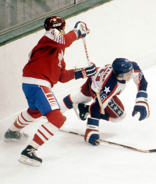 Canada's Robin Bartel (left) competes in hockey action against the United States at the 1984 Winter Olympics in Sarajevo. (CP PHOTO/ COA/O. Bierwagon )