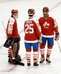 Team Canada's Mario Gosselin waves to the crowd as teammates Doug Lidster and Pat Flatley congratulate him after their game against the United States at the 1984 Winter Olympics in Sarajevo. (CP PHOTO/ COA/O. Bierwagon )