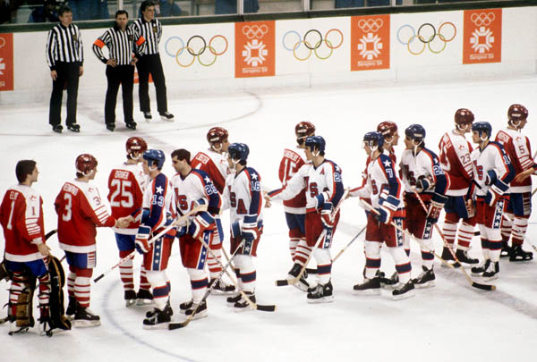 Team Canada exchanges wishes with Team U.S.A. at the end of a hockey game at the 1984 Winter Olympics in Sarajevo. (CP PHOTO/ COA/O. Bierwagon )