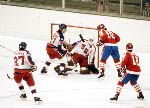 Canada's Bruce Driver (right) competes in hockey action against the United States at the 1984 Winter Olympics in Sarajevo. (CP PHOTO/ COA/O. Bierwagon )