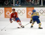 Canada's Doug Lidster (left) rounds the net during hockey action against Sweden at the 1984 Winter Olympics in Sarajevo. (CP PHOTO/ COA/O. Bierwagon )