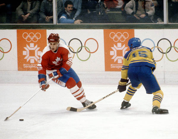 Canada's Doug Lidster (left) competes in hockey action against Sweden at the 1984 Winter Olympics in Sarajevo. (CP PHOTO/ COA/O. Bierwagon )