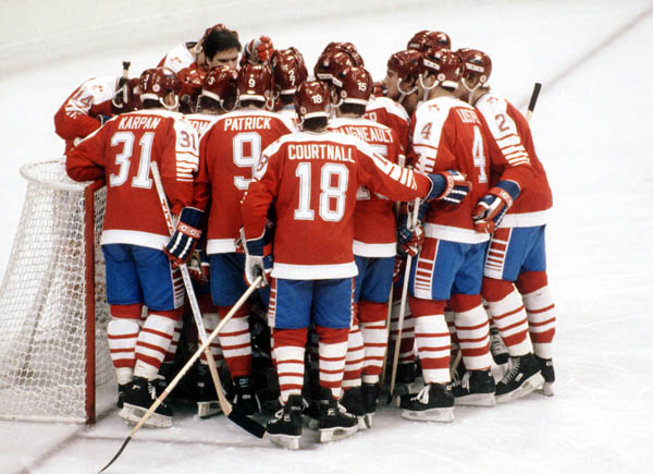 Team Canada gathers for an inspirational goal crease meeting before hockey action against the United States at the 1984 Winter Olympics in Sarajevo. (CP PHOTO/ COA/O. Bierwagon )