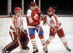 Canada's Patrick Flatley (in front) goes around the net during hockey action against the United States at the 1984 Winter Olympics in Sarajevo. (CP PHOTO/ COA/O. Bierwagon )