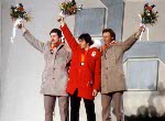 Canada's Gaetan Boucher (centre) celebrates after winning the gold medal in a speed skating event at the 1984 Winter Olympics in Sarajevo. (CP PHOTO/ COA/O. Bierwagon)