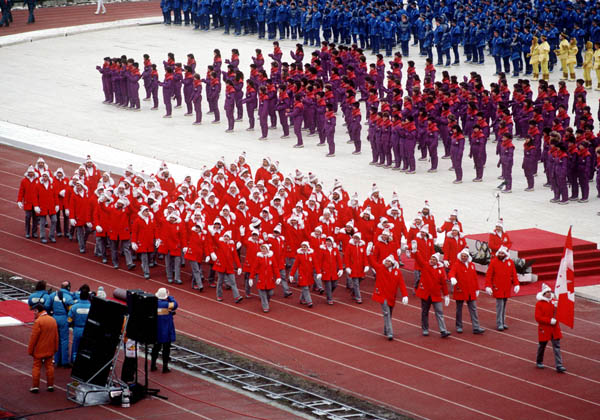 Gaetan Boucher leads Canadian athletes holding the flag as they make their entrance during the opening ceremonies at the 1984 Winter Olympics in Sarajevo. (CP PHOTO/COA/J. Merrithew )
