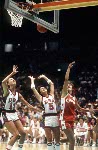Canada's Bev Smith (right) shoots for the hoop during women's basketball action at the 1984 Olympic Games in Los Angeles. (CP PHOTO/COA/JM)