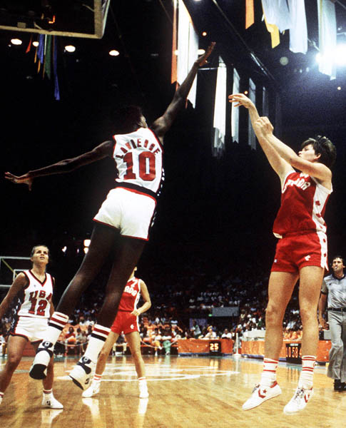 Canada's Bev Smith (right) shoots for the hoop during women's basketball action at the 1984 Olympic Games in Los Angeles. (CP PHOTO/COA/JM)