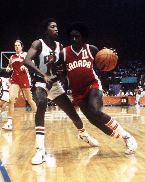 Canada's Sylvia Sweeney (right) runs past a guard during women's basketball action at the 1984 Olympic Games in Los Angeles. (CP PHOTO/COA/JM)