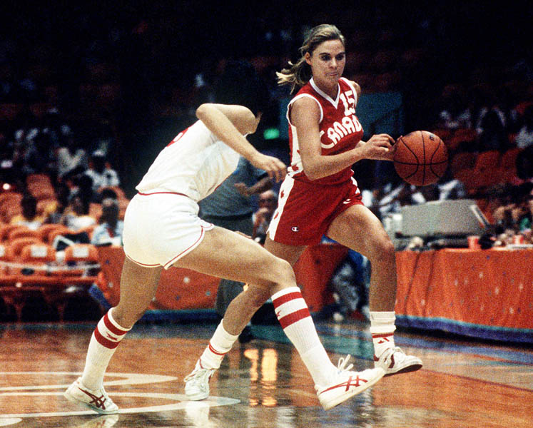 Canada's Misty Thomas (right) avoids an opponent during women's basketball action at the 1984 Olympic Games in Los Angeles. (CP PHOTO/COA/JM)