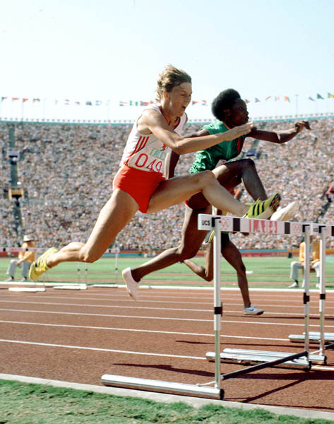 Canada's Sylvia Forgrave (left) jumps a hurdle in an athletics event at the 1984 Olympic games in Los Angeles. (CP PHOTO/ COA/JM)