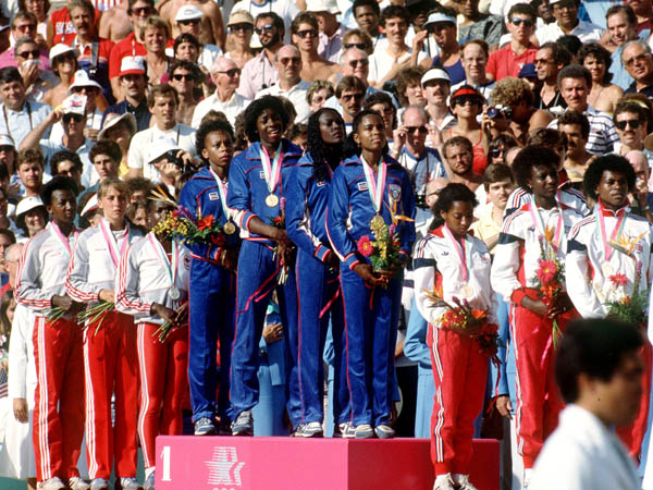 Canada's women's relay team (left) celebrate their silver medal win in the 4x400m relay event at the 1984 Olympic games in Los Angeles. (CP PHOTO/ COA/Crombie McNeil)