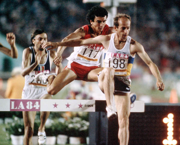 Canada's Greg Duhaime (centre) competes in the 3000m steeplechase event at the 1984 Olympic games in Los Angeles. (CP PHOTO/ COA/JM)