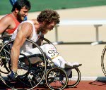 Canada's Andre Viger (front) and Mel Fitzgerald (left) compete in a wheelchair event at the 1984 Olympic games in Los Angeles. (CP PHOTO/ COA/J Merrithew)