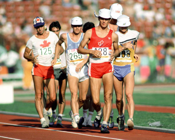 Canada's Marcel Jobin (125) and Guillaume Leblanc (128) compete in an athletics event at the 1984 Olympic games in Los Angeles. (CP PHOTO/ COA/JM)