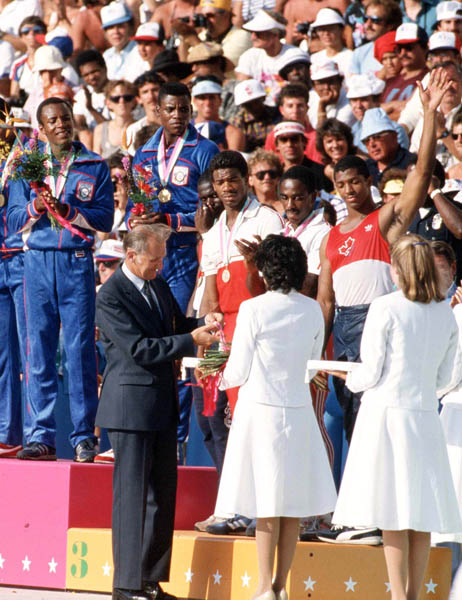 Canada's men's relay team (right) celebrates their bronze medal win in the 4x400m relay at the 1984 Olympic games in Los Angeles. (CP PHOTO/ COA/J. Merrithew)