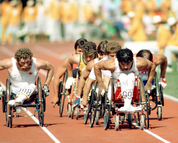 Canada's Mel Fitzgerald (left) and Andre Viger (front) compete in the wheelchair event at the 1984 Olympic games in Los Angeles. (CP Photo/COA/J. Merrithew)