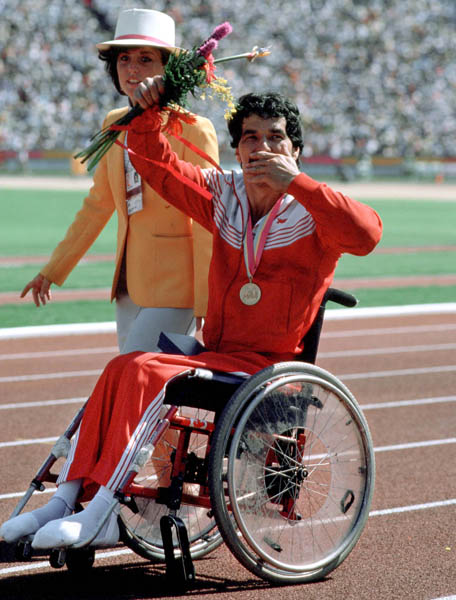 Canada's Andre Viger blows a kiis as he celebrates a gold medal win in the wheelchair event at the 1984 Olympic games in Los Angeles. (CP PHOTO/ COA/J Merrithew)