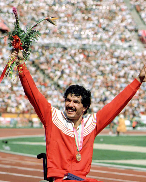 Canada's Andre Viger celebrates a gold medal win in the wheelchair event at the 1984 Olympic games in Los Angeles. (CP PHOTO/ COA/J Merrithew)