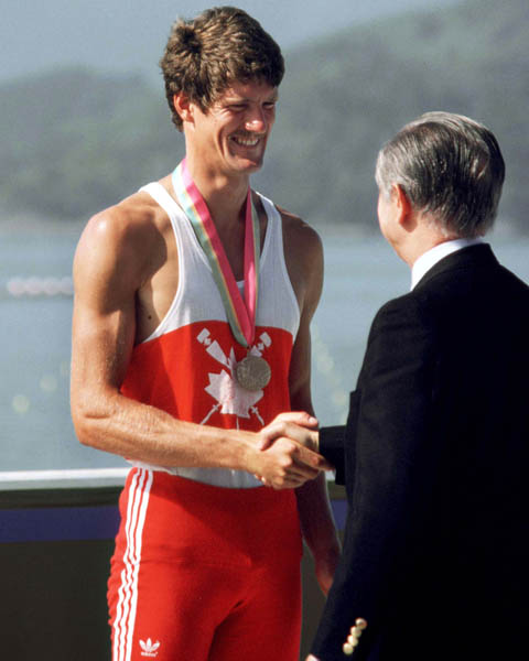 Canada's Bob Mills celebrates a bronze medal win in the men's singles rowing event at the 1984 Olympic games in Los Angeles. (CP PHOTO/ COA)