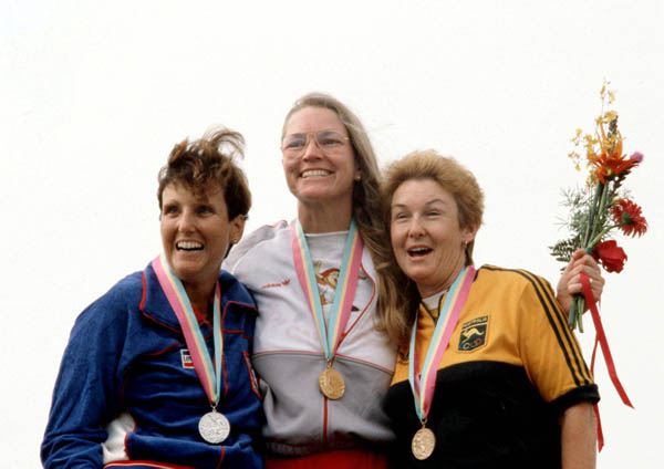 Canada's Linda Thom (centre) celebrates a gold medal win in a shooting event at the 1984 Olympic games in Los Angeles. (CP PHOTO/ COA/ Tim O'lett)