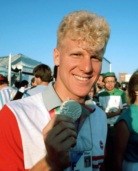 Canada's Curt Harnett shows his silver medal won in a track cycling event at the 1984 Olympic games in Los Angeles. (CP PHOTO/ COA/)