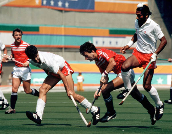 Canada's Rob Smith and Niki Sandhu (white shirts) play field hockey at the 1984 Los Angeles Olympic Games. (CP Photo/ COA/ Ted Grant)