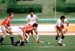 Canada's Ross Rutledge (left) and Satinder Chohan (centre)  play field hockey at the 1984 Los Angeles Olympic Games. (CP Photo/ COA/ Ted Grant)