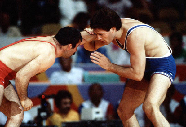Canada's Clark Davis (blue) competes in the wrestling event at the 1984 Olympic games in Los Angeles. (CP PHOTO/COA/Crombie McNeil)