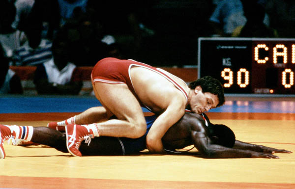 Canada's Clark Davis (red) competes in the wrestling event at the 1984 Olympic games in Los Angeles. (CP PHOTO/COA/Crombie McNeil)