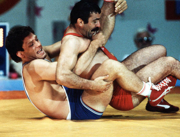 Canada's Clark Davis (blue) competes in the wrestling event at the 1984 Olympic games in Los Angeles. (CP PHOTO/COA/Crombie McNeil)