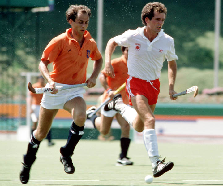 Canada's Bruce McPhearson (right) plays field hockey at the 1984 Los Angeles Olympic Games. (CP Photo/ COA/ Ted Grant)