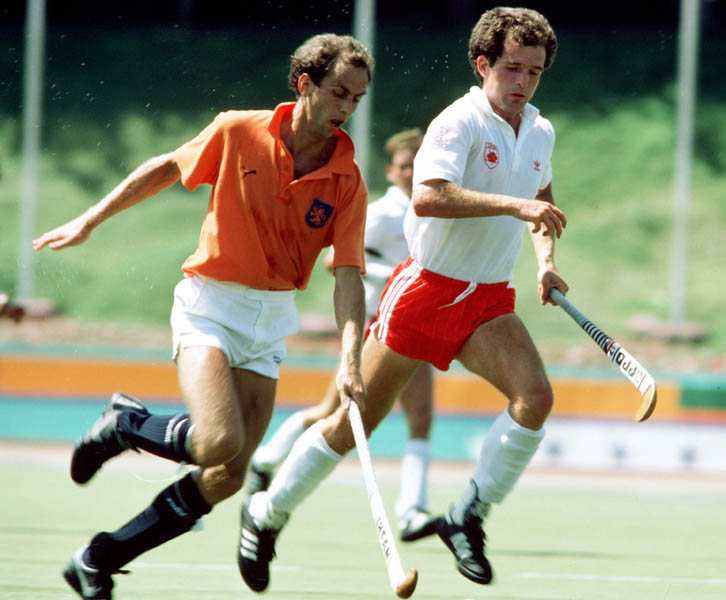 Canada's Bruce McPhearson (right) plays field hockey at the 1984 Los Angeles Olympic Games. (CP Photo/ COA/ Ted Grant)