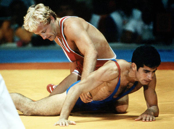 Canada's Dave McKay (red) competes in the wrestling event at the 1984 Olympic games in Los Angeles. (CP PHOTO/COA/Crombie McNeil)